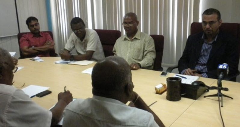 Minister of Natural Resources and the Environment Robert Persaud makes a point during the meeting with quarry operators on constraints affecting their production