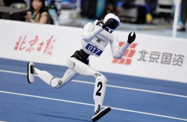 A Tiangong Omni humanoid robot competes during a 100m small-size group preliminary race, at the 2026 World Humanoid Robot Games [Tingshu Wang/Reuters]