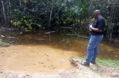 a build up of water at the corridor of the road as a result of the blocked koker