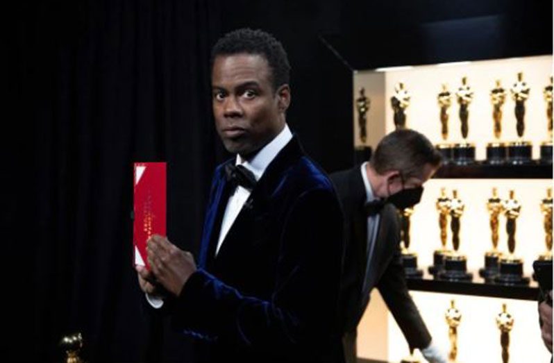 Chris Rock stands backstage at the 94th Academy Awards in Hollywood, Los Angeles, California, U.S., March 27, 2022. Al Seib/A.M.P.A.S./Handout via REUTERS