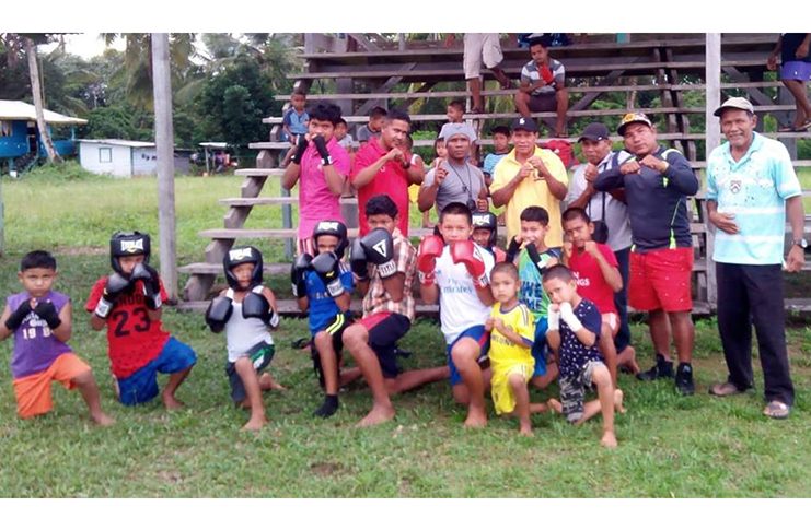 Hinterland boxing coach Orlon Rogers (third left standing) posed with members of the newly formed Wakapoa boxing gym in Region Two.
