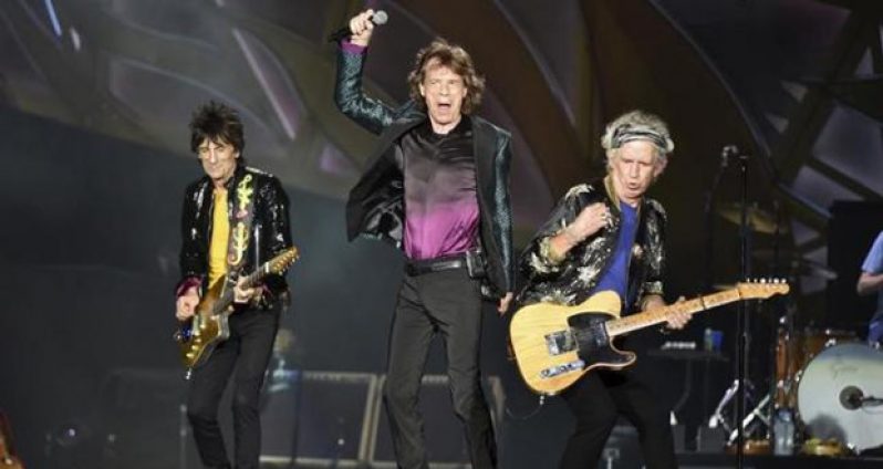 British veteran rockers The Rolling Stones lead singer Mick Jagger performs in front of bandmates Ron Wood (L) and Keith Richards during a concert on their North American ''Zip Code'' tour in Nashville, Tennessee June 17, 2015.