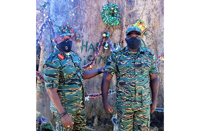 Chief of Staff, Brigadier Godfrey Bess with Lance Corporal Rolston Wright after he received his Christmas gift in the form of a promotion to Substantive Corporal