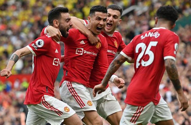 Cristiano Ronaldo celebrates with teammates Manchester United’s victory over Norwich