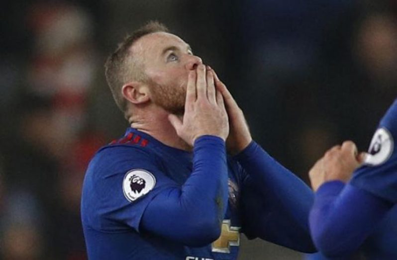 Manchester United's Wayne Rooney celebrates after scoring their first goal to break the all time goalscoring record for Manchester United Reuters / Darren Staples Livepic