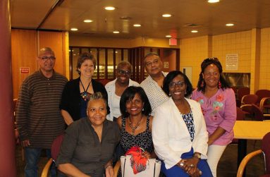 Seated L to R: Lorraine Croft-Farnell, President; Pauline Roman-Willis, Vice President;
and the Consul General to New York, Barbara Atherly. Also standing, from left to right,
are: Compton Grose, Asst. Secretary/Treasurer, Beverly D’Andrade-Waaldijk, Board
Member; Ingrid Thomas-Clark; Sonny Susankar; and Cameil Dalgetty-Jarvis