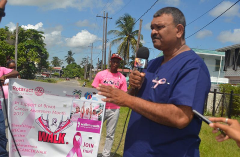 Dr Walter Singh makes a point to participants at the Breast Cancer Awareness Walk