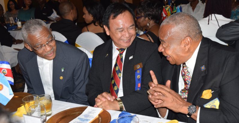 President David Granger; Rotary’s Immediate Past District Governor, Elwin Atmodimedjo; and Past District Governor Dunston Barrow interact during the World Understanding Day Dinner at the Pegasus Hotel on Friday 
(Cullen Bess-Nelson photo)
