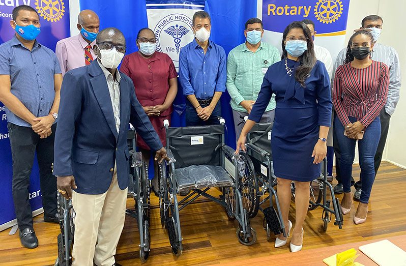 Rotary Club President, Ramona Singh presents a wheelchair to CEO of GPHC, Brigadier (ret’d) George A. Lewis, in the presence of other officials
