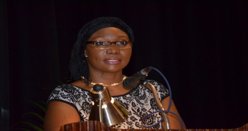Principal Viola Rowe delivering her report at the college’s 81st graduation ceremony at the National Cultural Centre (GINA Photo)