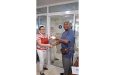 Mrs. Roxanne Hopkinson of Secure Innovation and Concepts Inc., hands over sponsorship to Lennox Braithwaite