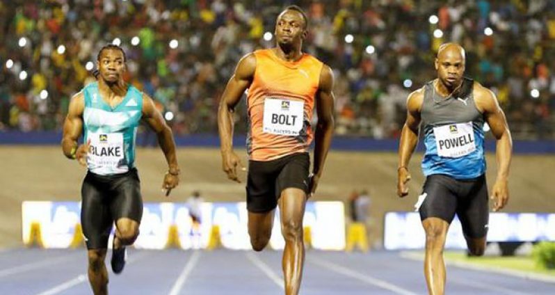 Jamaica National Racers Grand Prix: Yohan Blake (L), winner Usain Bolt (C) and Asafa Powell in action during men's 100m race.