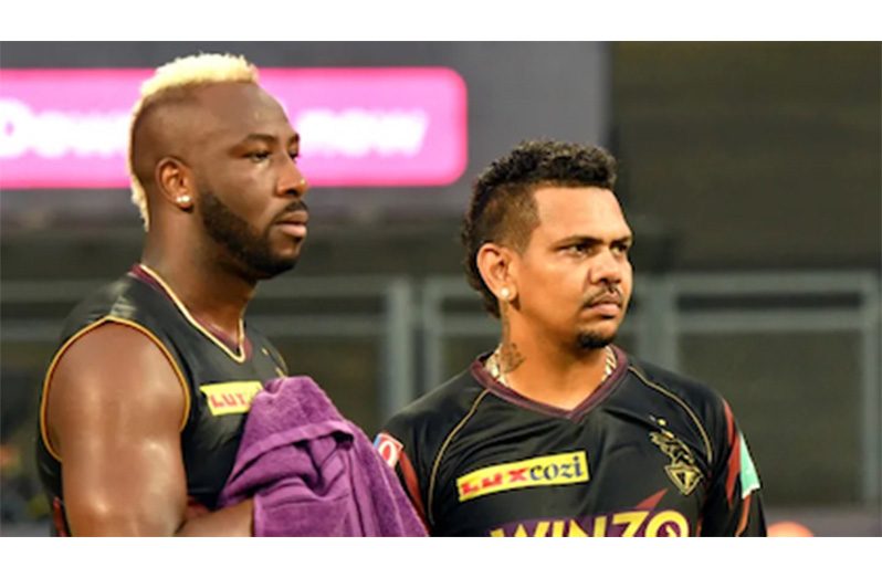Andre Russell (left) and Sunil Narine were left disappointed after their match against Royal Challengers Bengaluru was abandoned without a ball being bowled