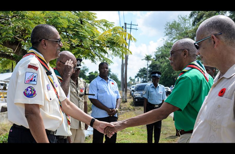 President David Granger being greeted by President of the Scouts Association of Guyana, Ramsay Ali  (Delano Williams photo)