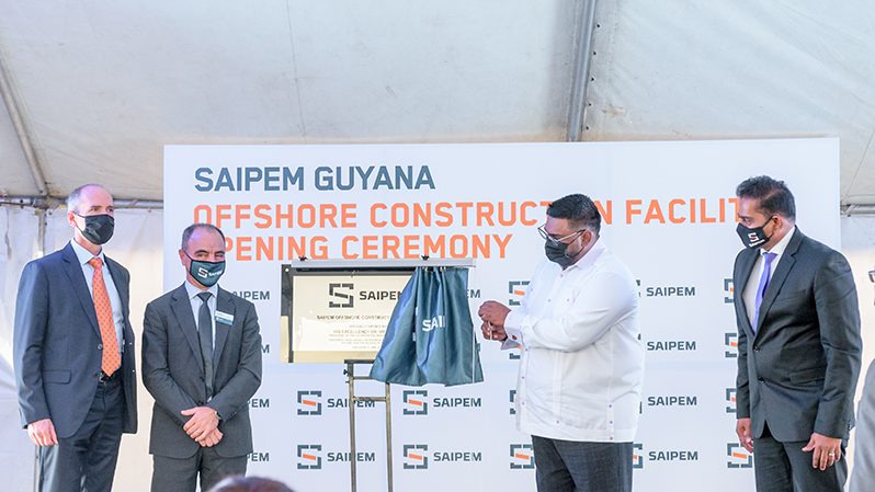 (From left) Alistair Routledge, President of ExxonMobil Guyana; Giorgio Martelli, President and CEO of SAIPEM America; President Dr. Irfaan Ali; and Managing-Director of Saipem Guyana Inc., Thuranthiran Nadaraja, unveiling the SAIPEM Guyana Offshore Construction Facility plaque on Saturday (Delano Williams photo)