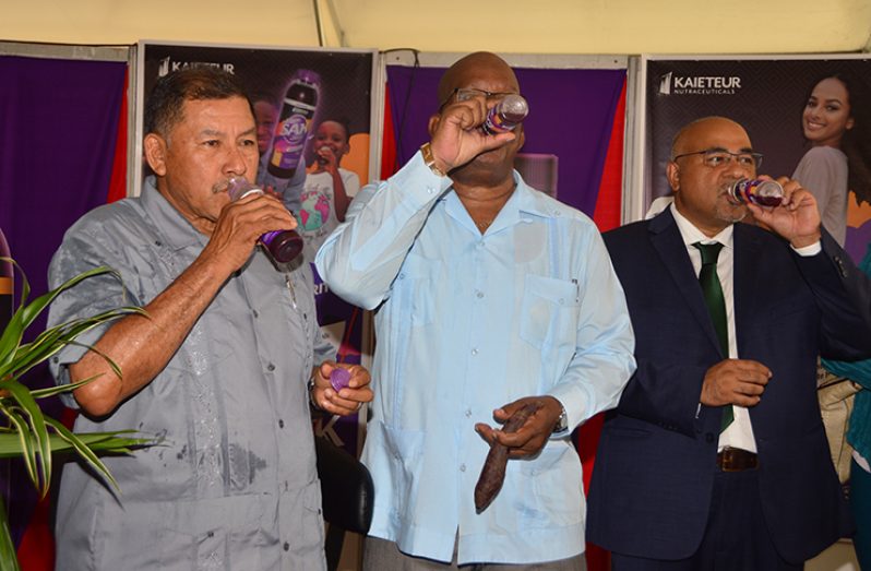 Minister of Indigenous Peoples’ Affairs, Sydney Allicock; Minister of Finance Winston Jordan and IAST Chairman, Dr. Suresh Narine sample the new drink