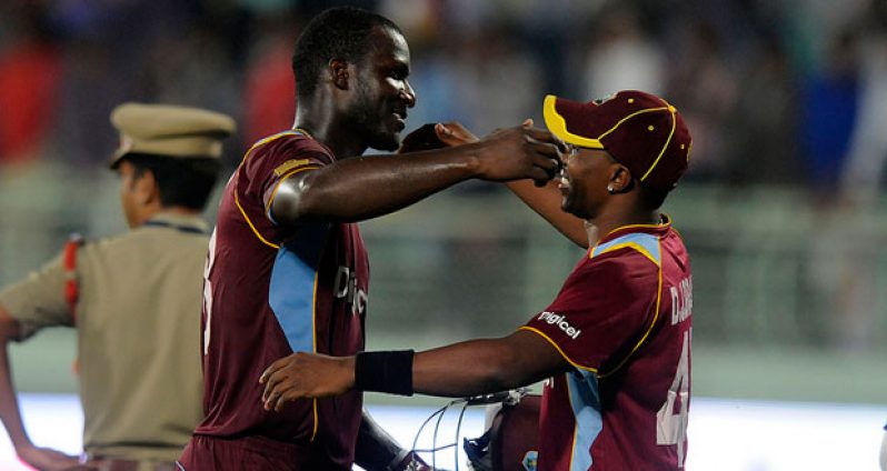 Dwayne Bravo captain of West Indies congratulates team mate Darren Sammy of West Indies after the win during the second Star Sports One Day International (ODI) match between India and The West Indies held at the Dr. Y.S. Rajasekhara Reddy ACA-VDCA Cricket Stadium, Vishakhapatnam, India yesterday.Photo by: Pal Pillai - BCCI - SPORTZPICS