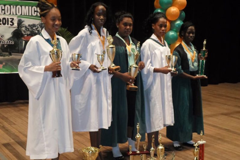 Leading performers display their trophies at the graduation.