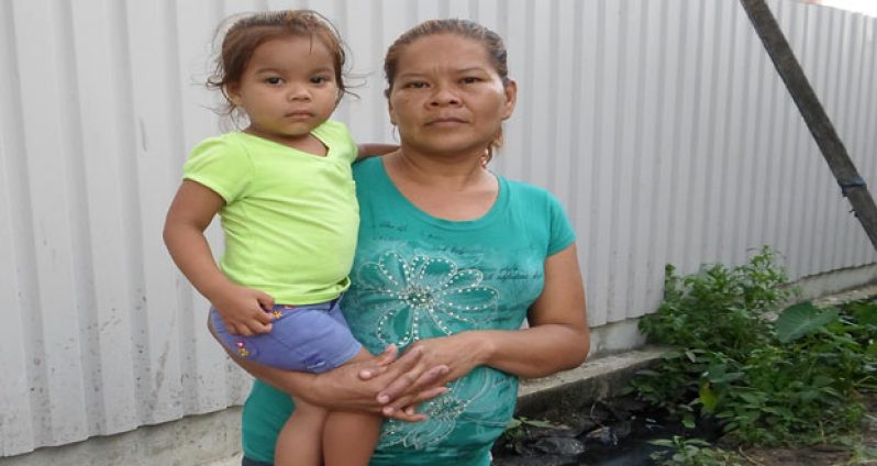 Baby Haley Thomas and her grandmother Tabitha Thomas outside their Kitty home Tuesday afternoon