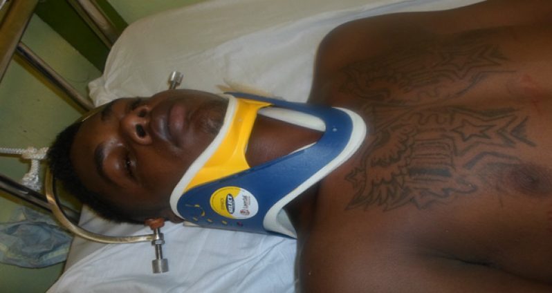 The injured Damian Deodhdarry lies motionless on the hospital bed.