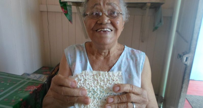 Ann Vieira displays a piece of her cherished handicraft