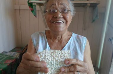 Ann Vieira displays a piece of her cherished handicraft