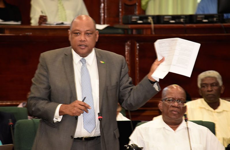 Natural Resources Minister Raphael Trotman referencing the Speaker’s Ruling No. 5 of 2013 (Photo by Adrian Narine)