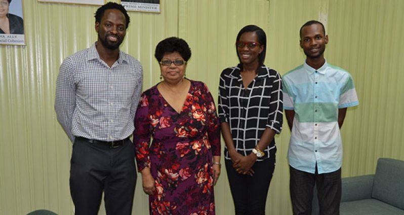 Minister of Social Cohesion, Ms. Amna Ally is flanked by, from left to right: Mr. Joel Simpson, Director, SASOD, Ms. Schemel Patrick, Advocacy and Communications Manager, SASOD and Mr. Jairo Rodrigues, Social Change Coordinator, SASOD.