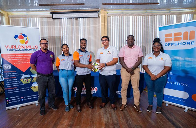 Participating students of the Women in Football Development Programme with members of the SBM Offshore Guyana team, Vurlon Mills Football Academy team, Technical Director of the Guyana Football Federation, Mr. Bryan Joseph and Ministry of Education representative, Mr. Nicholas Fraser