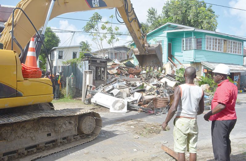 An excavator used to remove the bulk of scrap metal and other materials on Norton Street