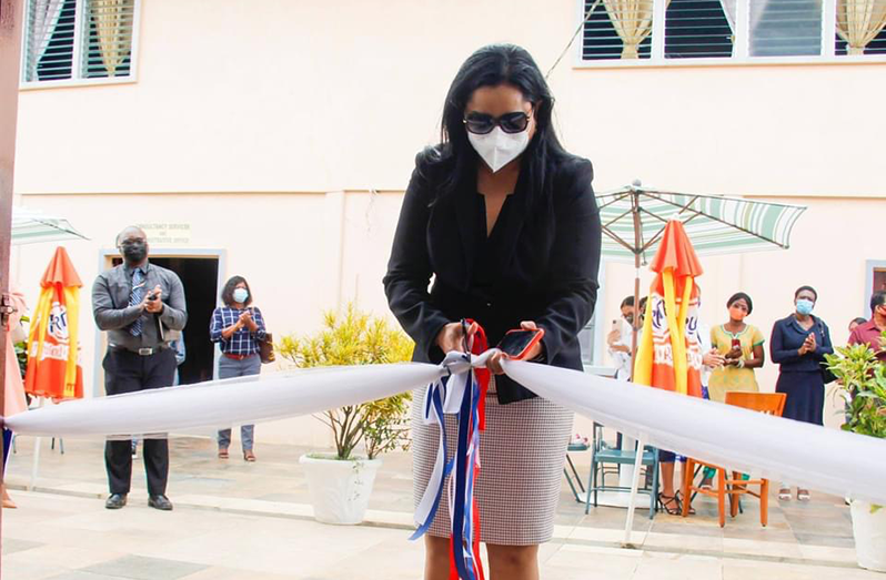Minister Vindhya Persaud cutting the ribbon, declaring the SFCD resource centres open.