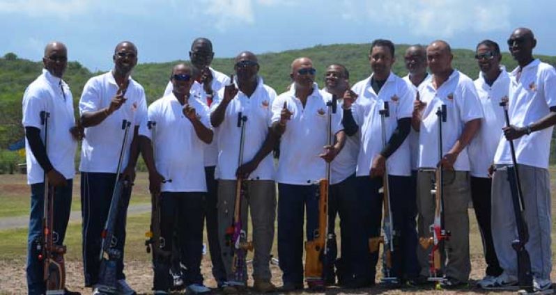 The triumphant Guyana team  pose with their rifles.