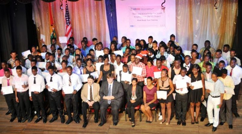 Deputy Chief of Mission of the U.S. Embassy Mr. Bryan Hunt (seated, front row centre) and the SKYE Graduates