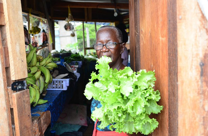 Garraway showing off freshly picked organic lettuce from her granddaughter’s kitchen garden