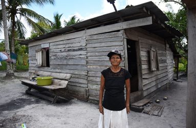 Dundas standing in front of her humble abode