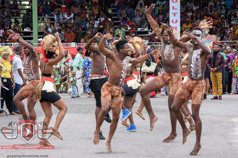 A group of marchers entertain the crowd with their antics, as part of the cultural show (Samuel Maughn photo)
