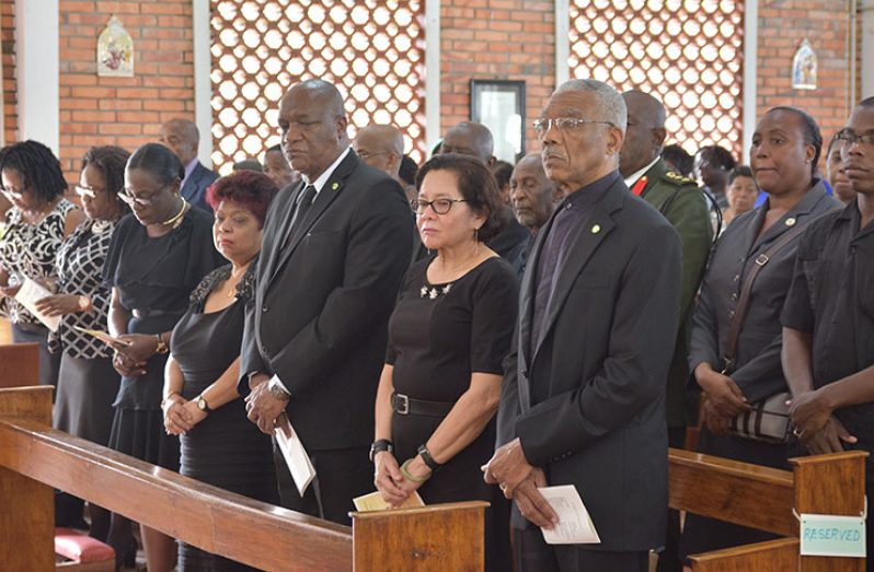 Standing at right is President David Granger, next to his wife, Mrs. Sandra Granger; Minister of State Joseph Harmon; Minister of Social Protection, Ms. Amna Ally and family members of the deceased.