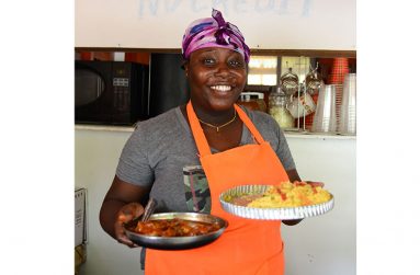 Rushanna Liverpool displays samples of dishes for sale (Samuel Maughn photos)