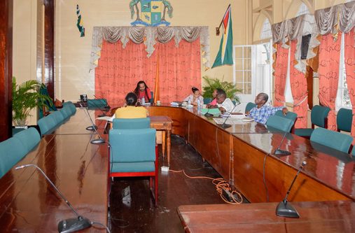 Members of the Mayor and City Council (M&CC) renegotiating committee awaiting the arrival of the Taxi-drivers, mini-bus operators and operators of vehicles used for commercial purposes at the second day of public consultations on the parking meter project