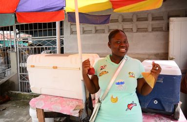 Jenel Burgess at the Plaisance Railway Embankment manning Stacy’s Fresh Fruit Juice business outlet (Samuel Maughn photos)