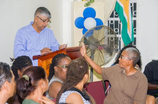 WPA’s Dr Wazir Mohammed reads the petition as party member, Karen DeSouza, makes a point