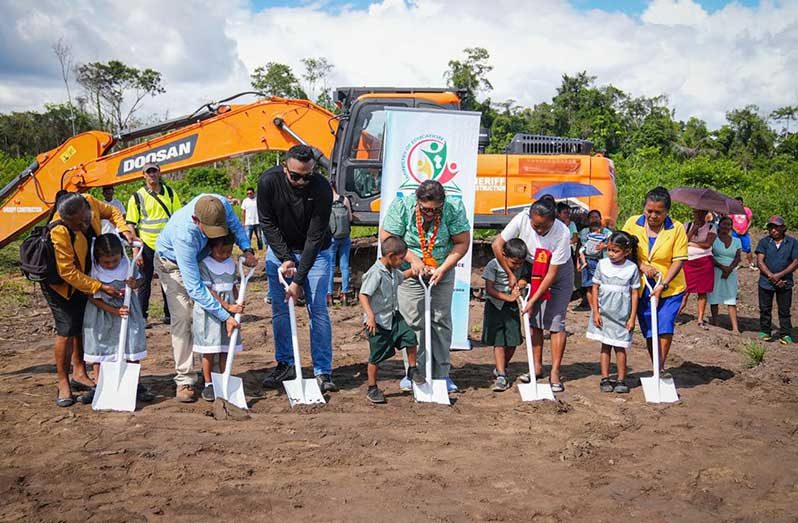 Minister of Education Priya Manickchand, along with students, teachers and other officials during the sod-turning ceremony for the construction of a new secondary school, valued at $231M for the community of Jawalla in Region Seven