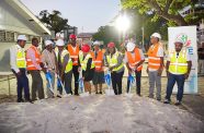 Minister of Education Priya Manickchand turns the sod while being flanked by other officials at the ceremony at St. Stanislaus College