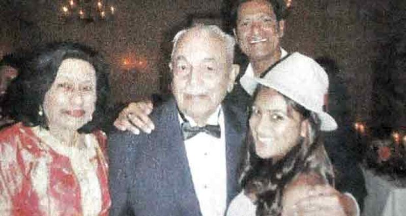 Soorsati Ramsamooj (left) with her husband Mohan, Dr. Vic Rampertaap, and
his daughter Asha.
