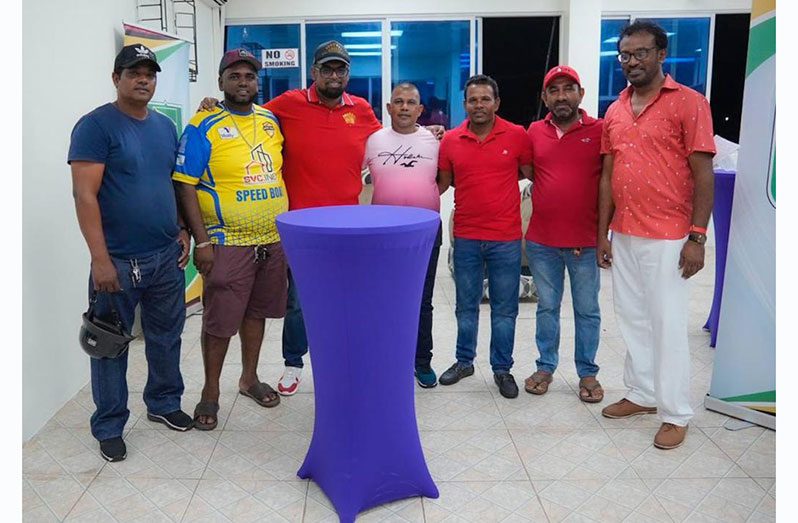 President Dr. Irfaan Ali and Head of Region Three Private Sector Inc, Halim Khan (extreme right) met with speedboat operators on Sunday (Office of the President photo)