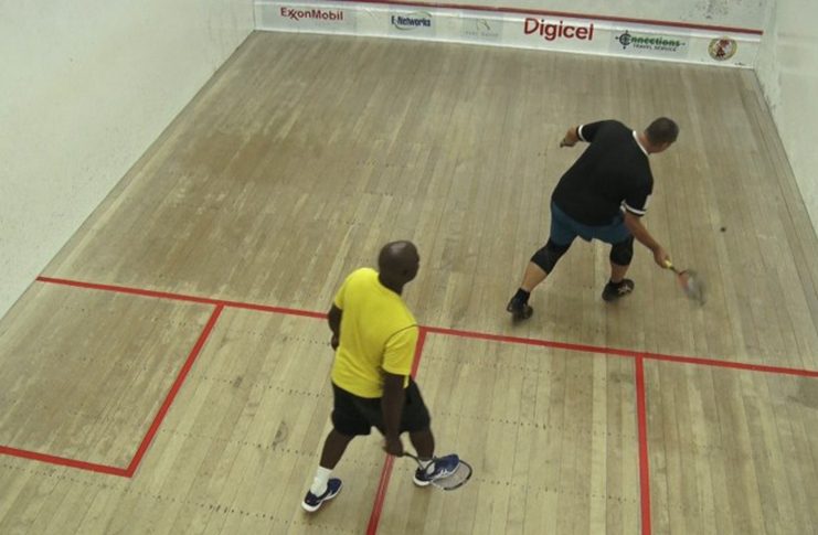 David Fernandes attempts a shot against Marlon White in the Over-45 category.