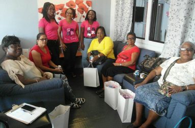 SRHR Adventurers, standing in background, with the ladies of the Beacon Foundation after receiving their gifts and sharing their experiences with cervical cancer