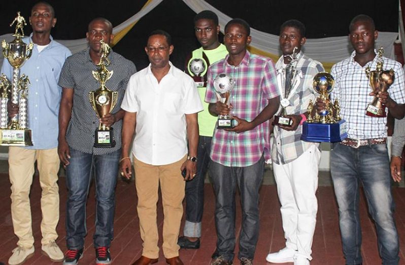 The various winners of the 2015/2016 GFA/STAG premier league stand with GFA president Clifton Hicken