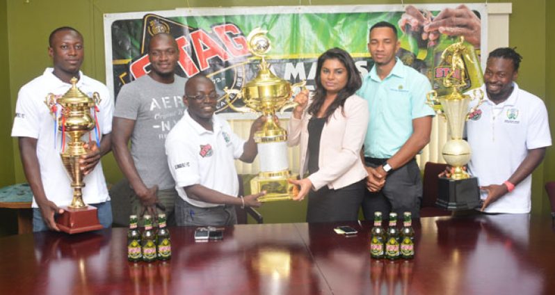 (From left to right) – Slingerz FC captain Tichard Joseph, Slingerz FC PRO Rawle Toney, Slingerz FC GM Collin Aaron, Ansa McAl’s PRO Darshanie Yussuf, Stag Beer Brand Rep. Shawn Abel and Slingerz FC player Philbert Moffat. (Samuel Maughn photo)