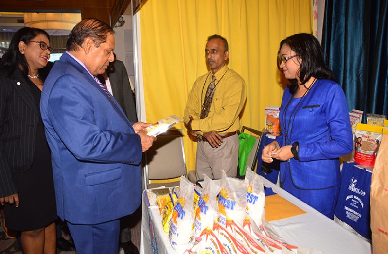 Prime Minister Moses Nagamootoo inspects the High Fiber Whole Wheat Flour produced by the National Milling Company of Guyana Inc (NAMILCO) (Adrian Narine photo)